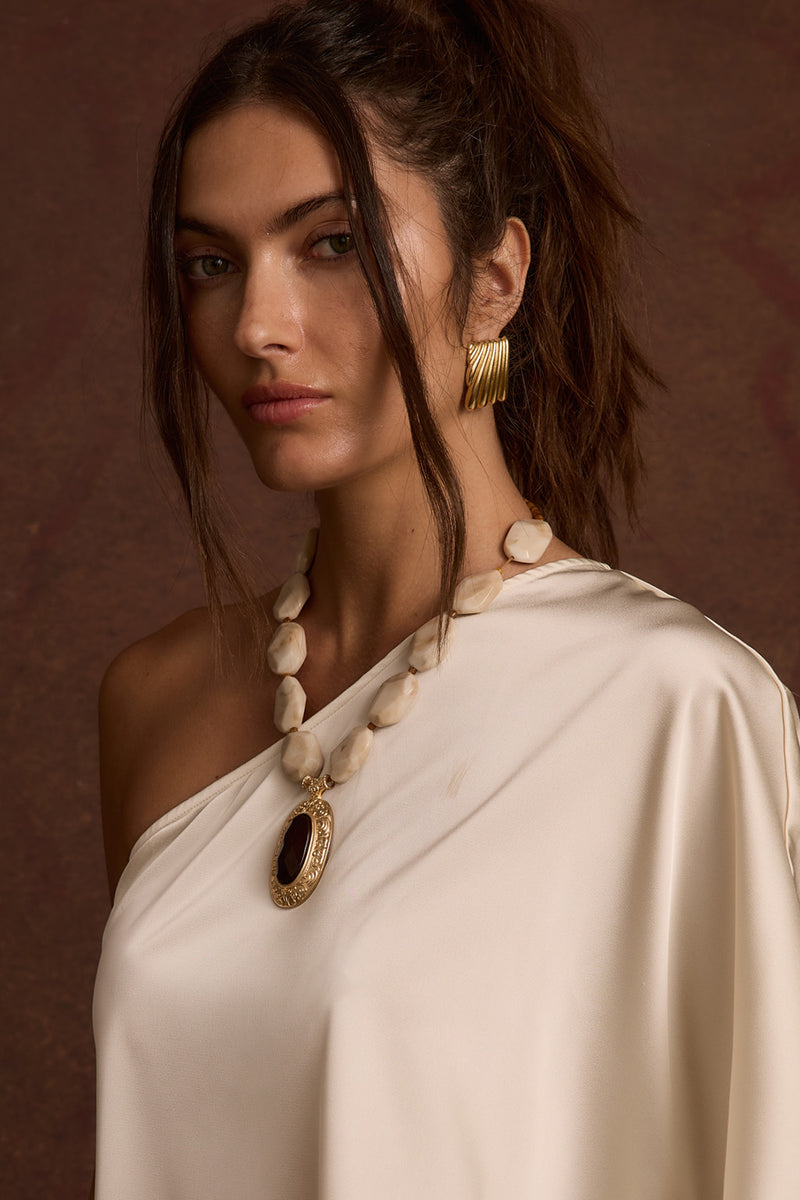 Cressida Pendant Necklace paired with complementary accessories for a polished look.