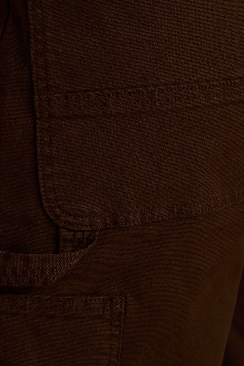 Close-up of mocha brown cargo short cotton canvas with topstitched flap pocket detail.