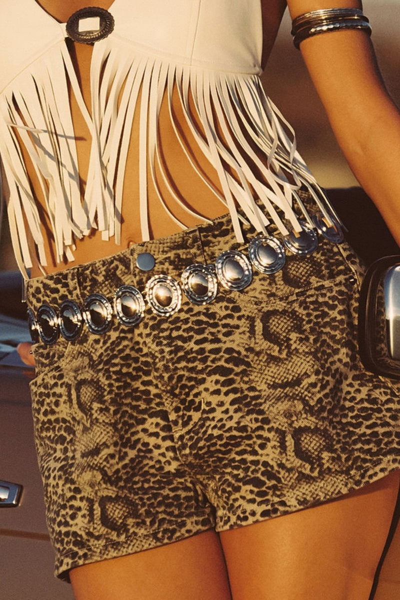 Gold belt with refined detailing and a flattering silhouette.