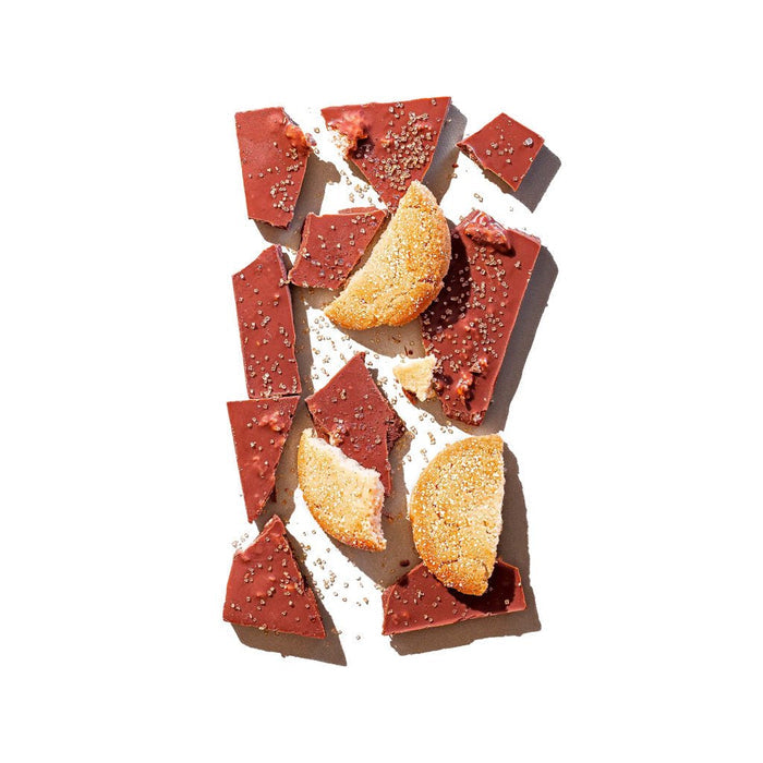 Broken sugar cookie chocolate bar with cookie pieces on top.
