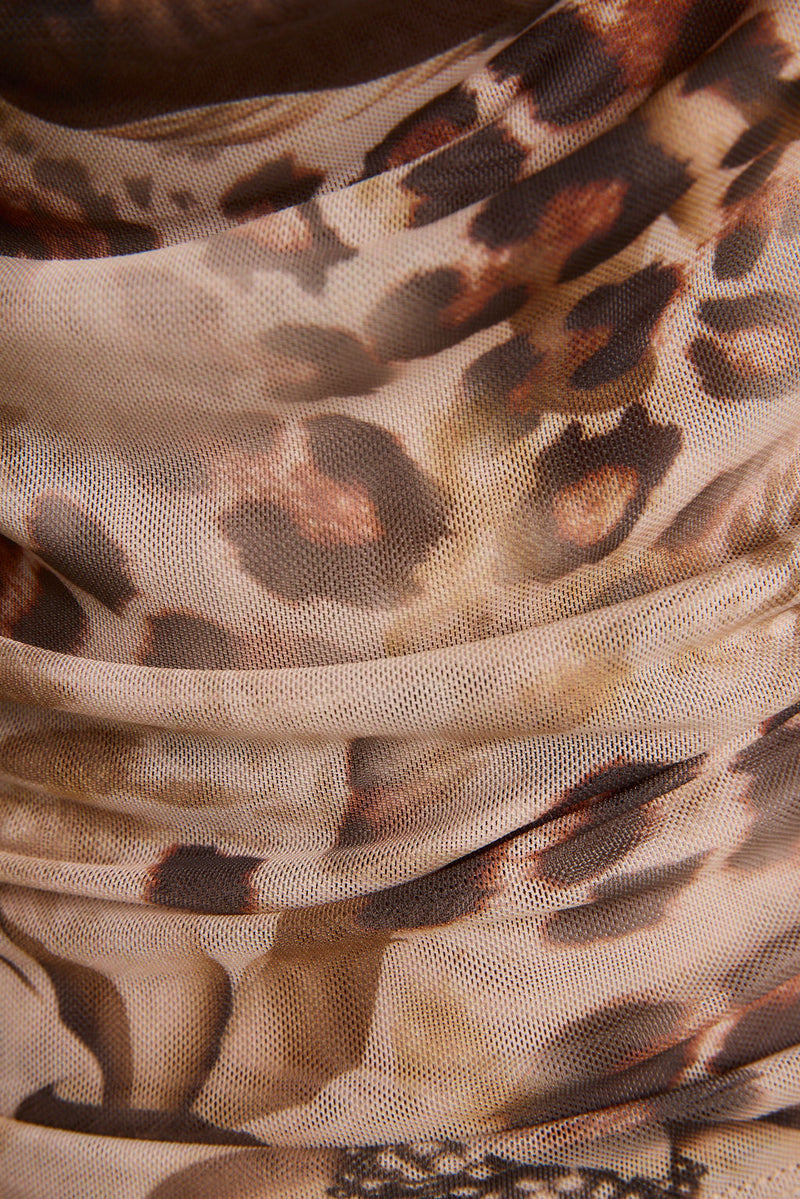 Detail shot of the Sundown Animal Cowl Neck Blouse highlighting the design elements.
