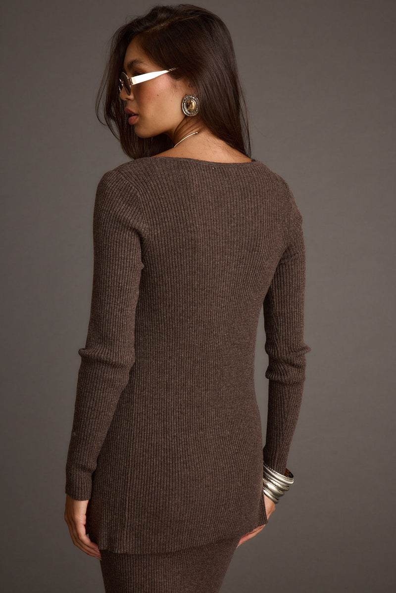 Lifestyle shot of the mocha sweater styled for day-to-night versatility.
