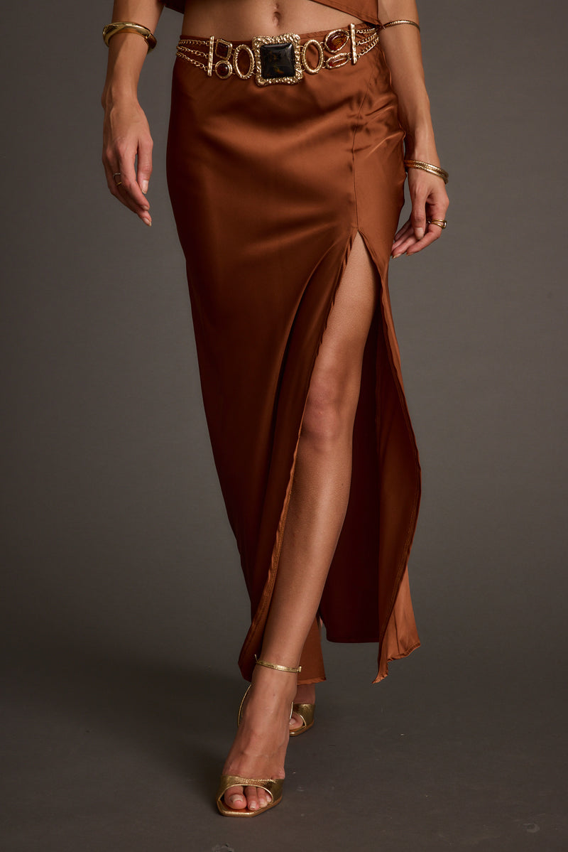 Full-length view of the maxi skirt showing the drape and movement.