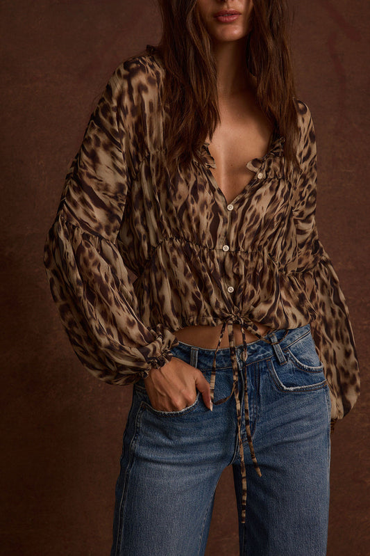 Leopard print chiffon blouse with refined detailing and a flattering silhouette.