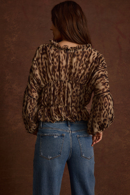 Back view of the leopard print chiffon blouse showing the silhouette and fit.