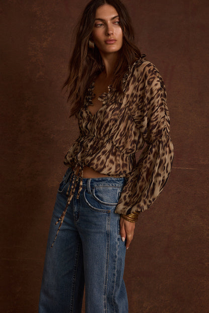 Alba Leopard Chiffon Long Sleeve Blouse paired with complementary accessories for a polished look.