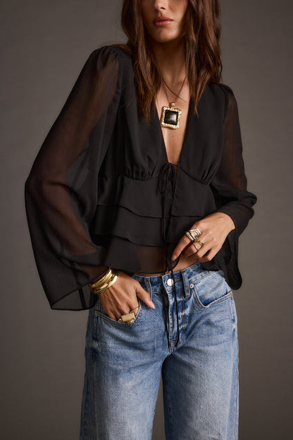 Alexa Black Blouse paired with complementary accessories for a polished look.