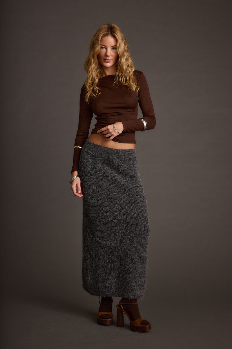 Sweater with elegant accents, a lace maxi skirt essential.