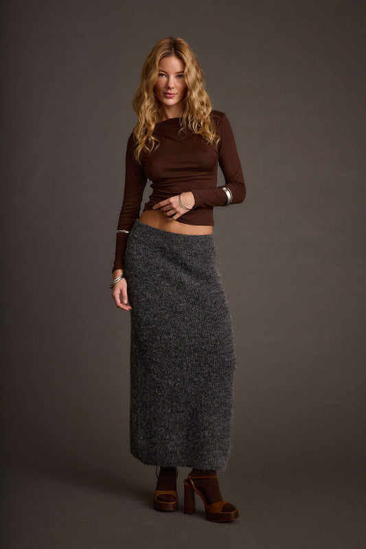 Sweater with elegant accents, a lace maxi skirt essential.