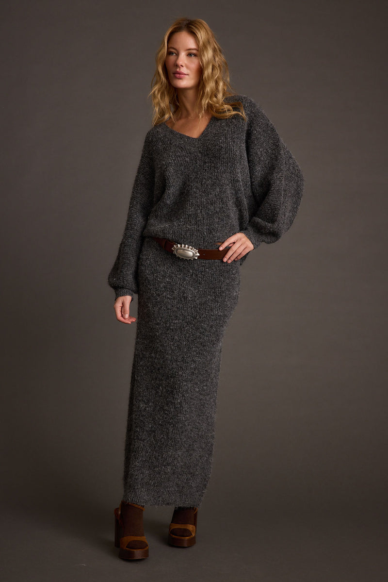 Close-up of the Glacier Charcoal V Neck Sweater showcasing the fabric texture and design details.
