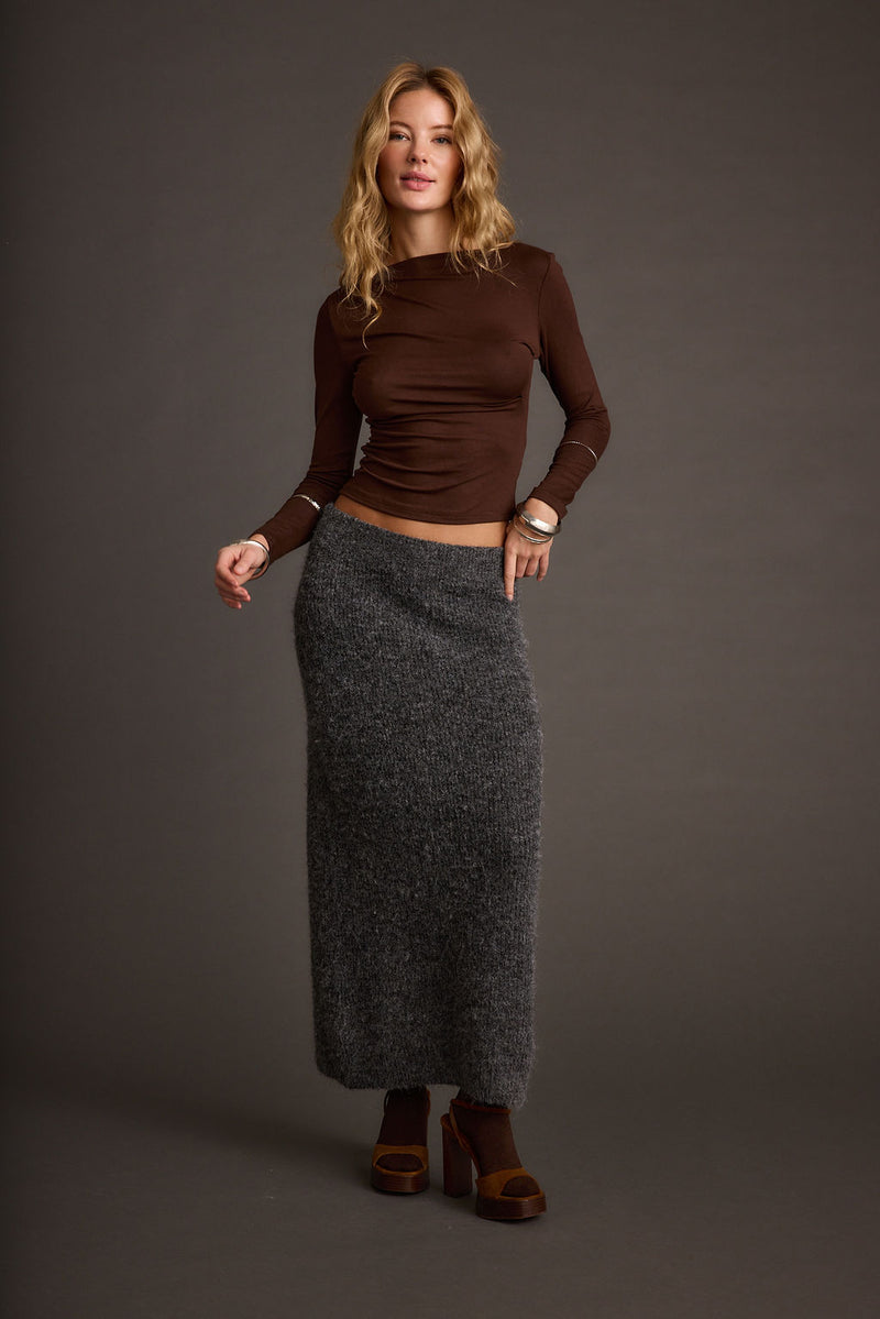 Lifestyle shot of the sweater styled for day-to-night versatility.