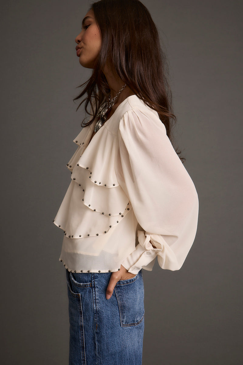 Alyssa Ivory Studded Blouse shown in a complementary styling arrangement.
