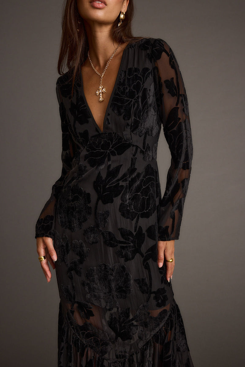 Close-up of the Angela Black Velvet Burnout Long Sleeve Maxi Dress showcasing the velvet texture and craftsmanship.