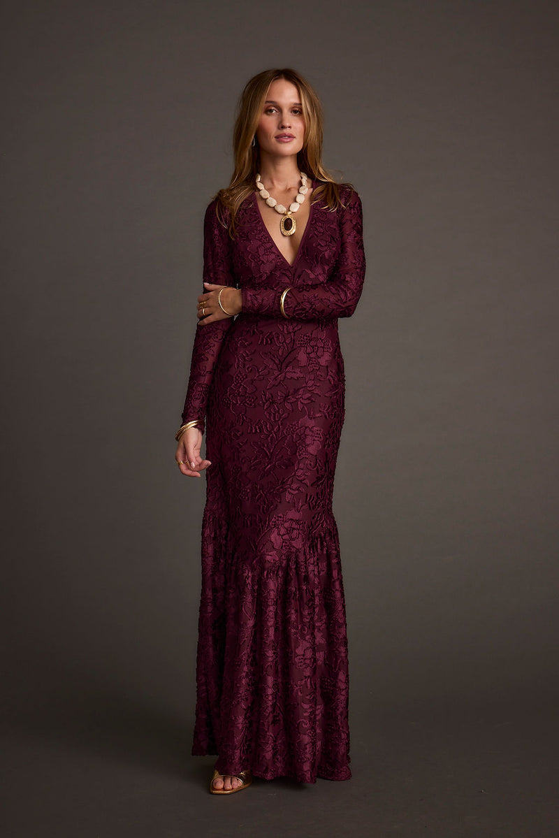 Back view of the velvet maxi dress showing the silhouette and fit.