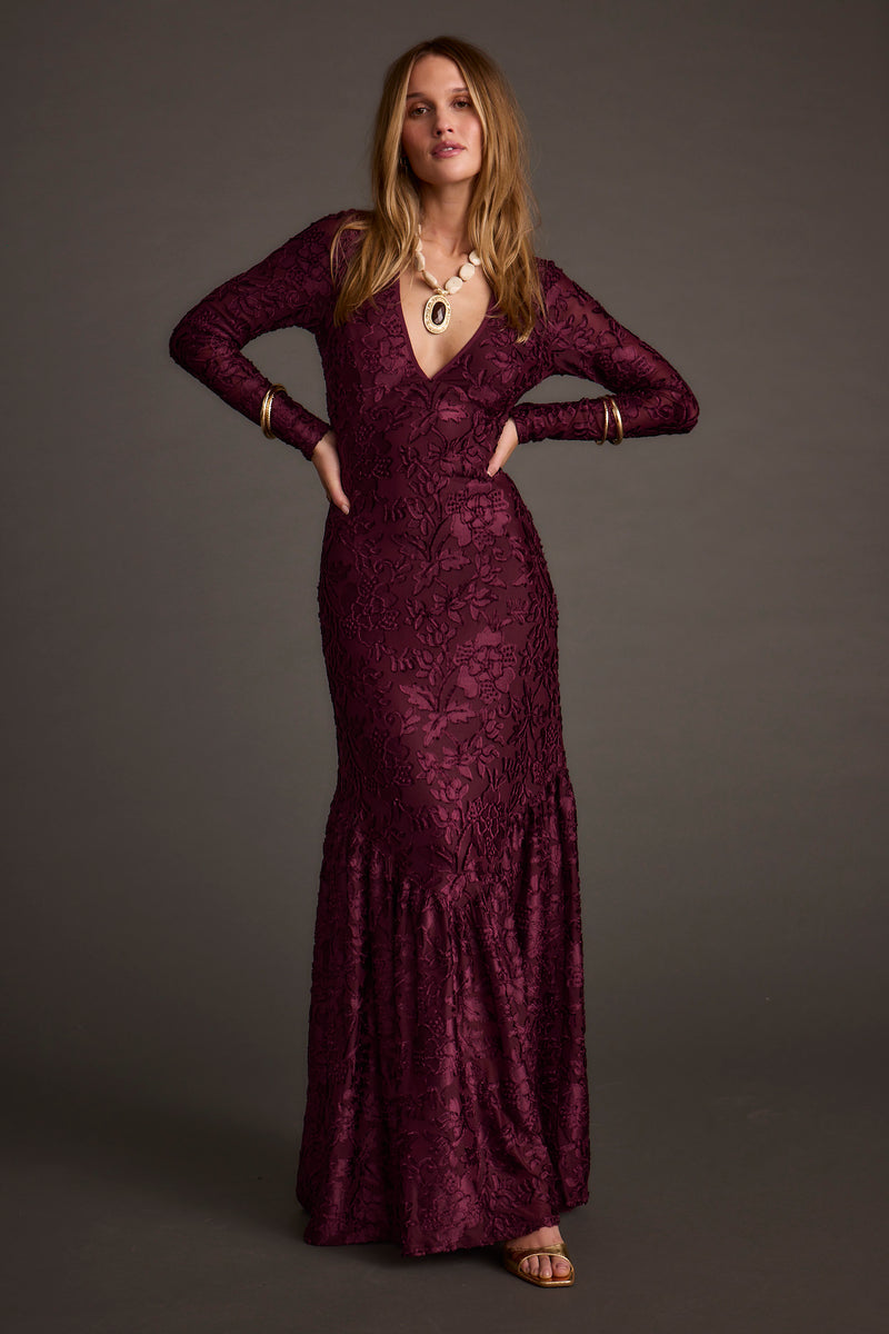 Full-length view of the maxi dress showing the drape and movement.