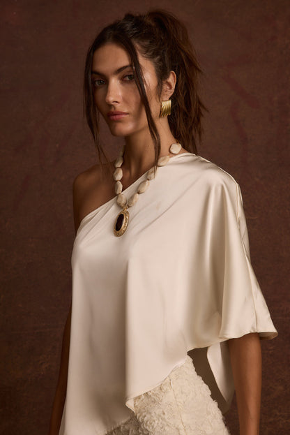 Anya Ivory One Shoulder Top paired with complementary accessories for a polished look.