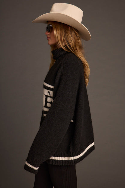 Apres Black and White Turtleneck Sweater paired with complementary accessories for a polished look.