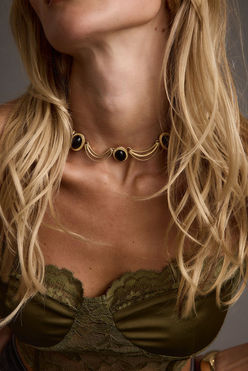 Arabella Gold and Black Stone Choker Necklace shown from a different angle, highlighting the metalwork details.