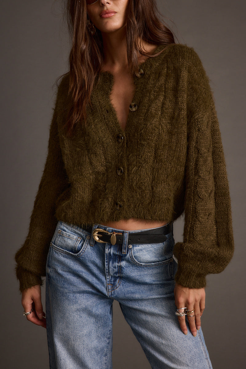 Olive cropped cardigan with refined detailing and a flattering silhouette.