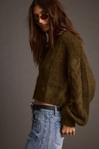 Full-length view of the olive cardigan showing the drape and movement.