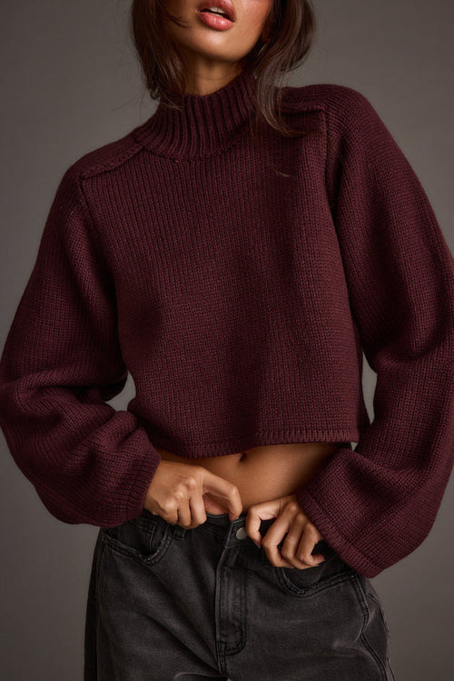 Plum cropped sweater with refined detailing and a flattering silhouette.