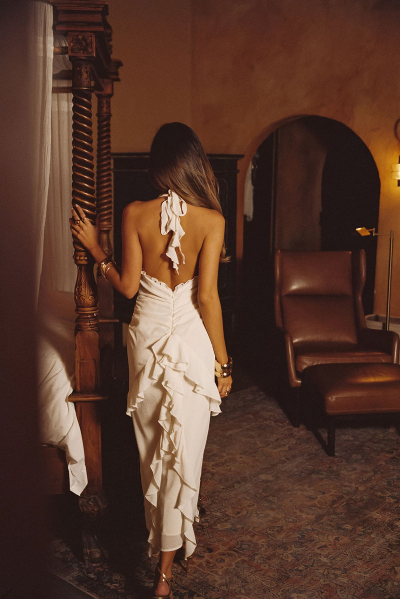 Back view of the cream maxi dress showing the silhouette and fit.
