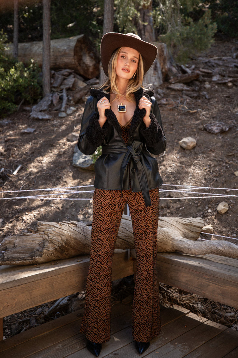Close-up of the Banks Black Belted Coat showcasing the fabric texture and design details.