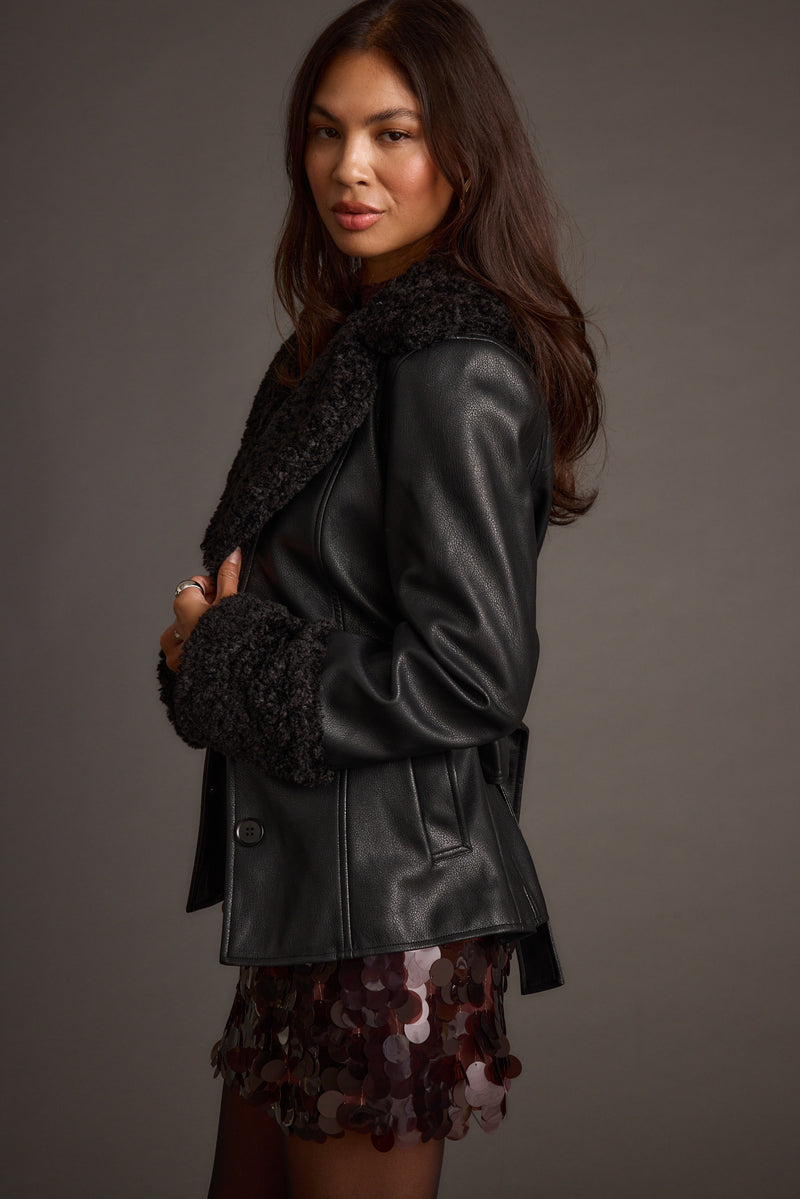 Detail shot of the Banks Black Belted Coat highlighting the design elements.