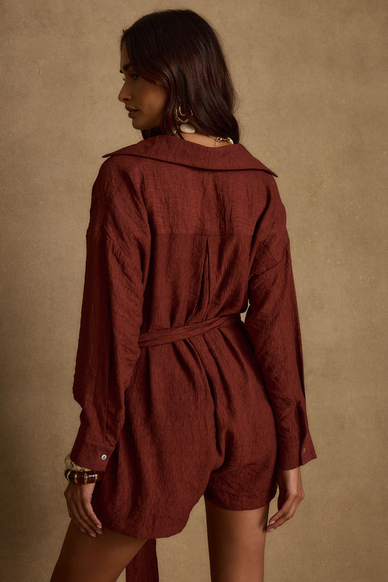 Detail shot of the Barcelona Rust Belted Romper highlighting the design elements.
