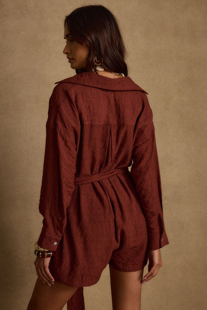 Detail shot of the Barcelona Rust Belted Romper highlighting the design elements.