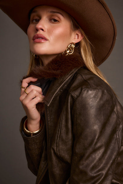 Close-up of the Beckett Espresso Vegan Leather Jacket showcasing the vegan leather texture and craftsmanship.