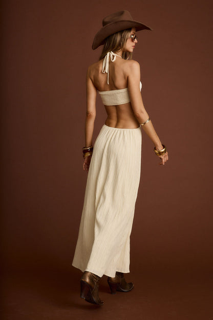 Back view of the cream maxi dress showing the silhouette and fit.