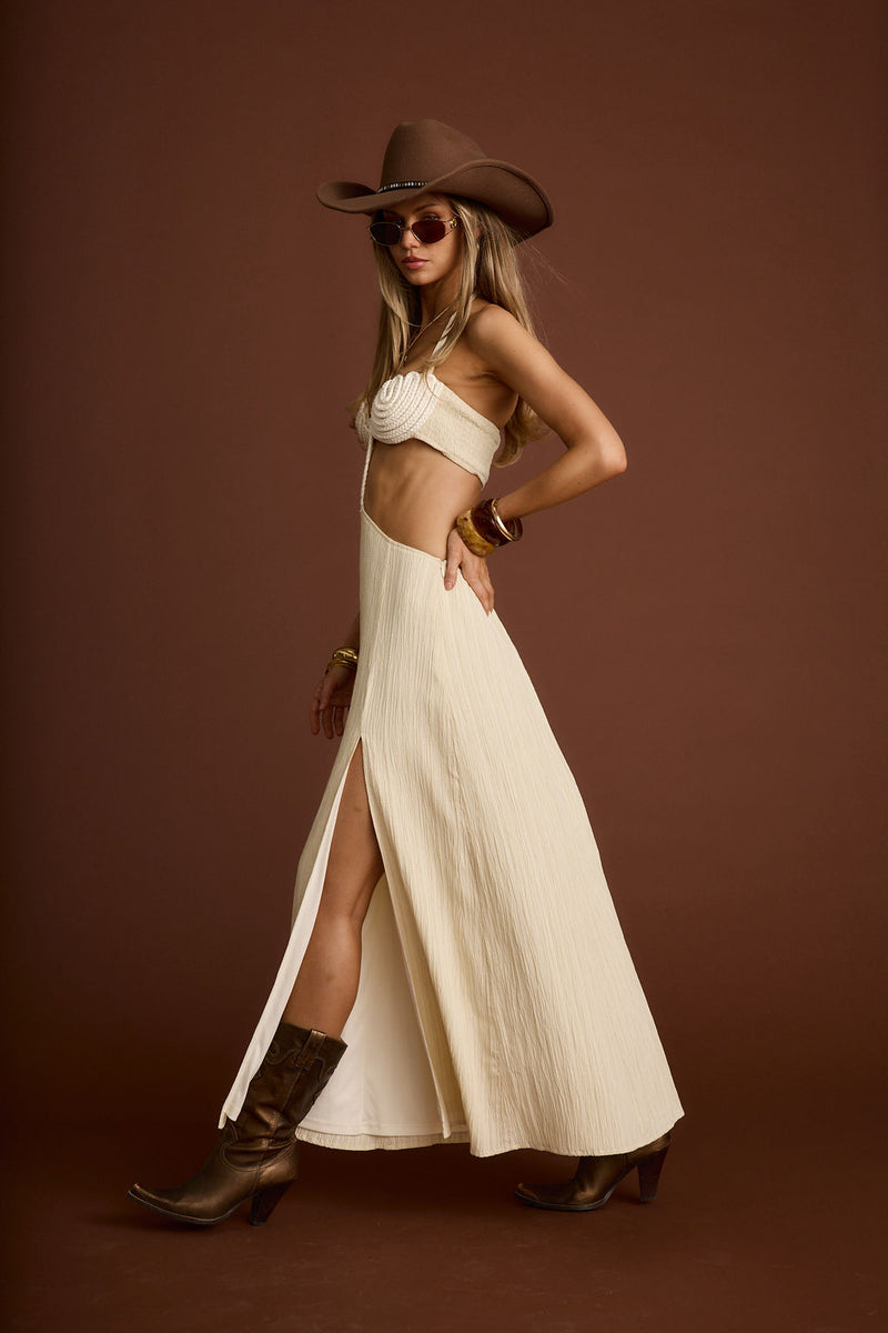 Close-up of the Bella Donna Cream Braided Maxi Dress showcasing the fabric texture and design details.