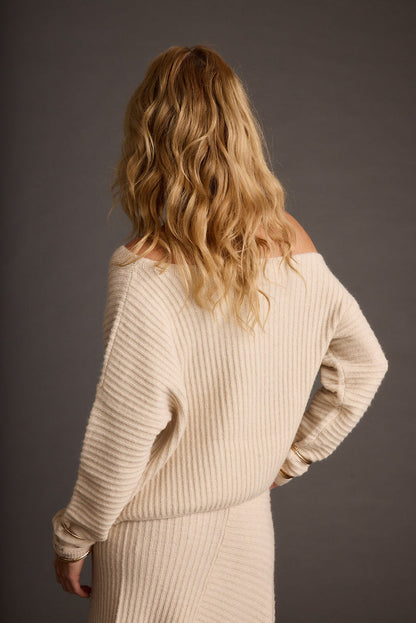 Close-up of the Blanc Cream Off the Shoulder Sweater showcasing the fabric texture and design details.