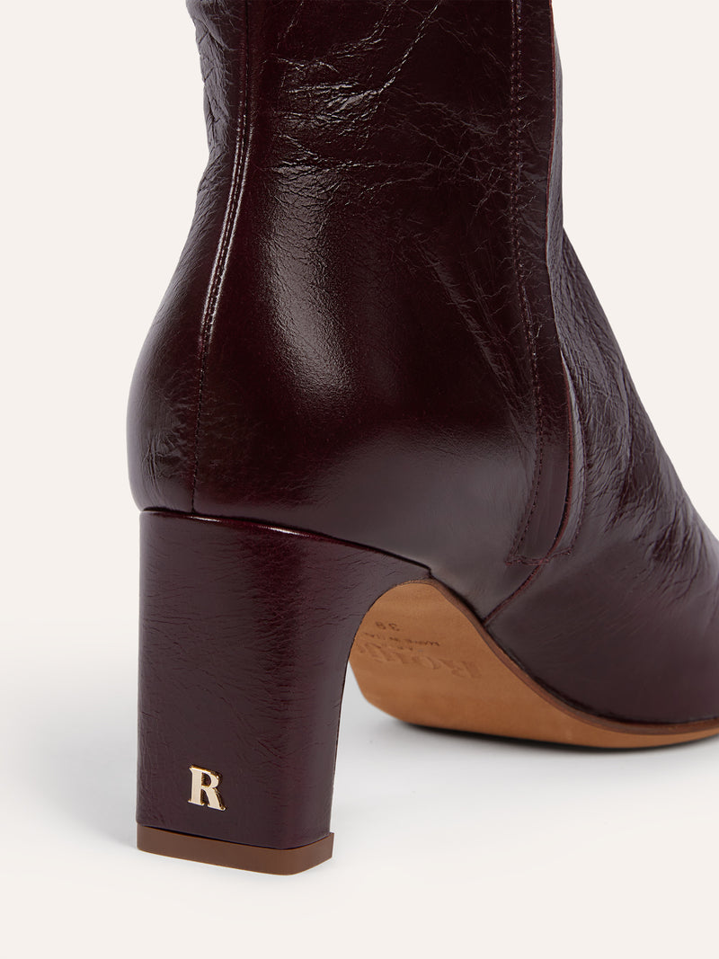 ELSA aged burgundy leather ankle boots worn on a model by Rouje