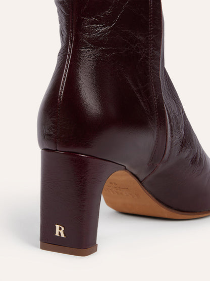 ELSA aged burgundy leather ankle boots worn on a model by Rouje