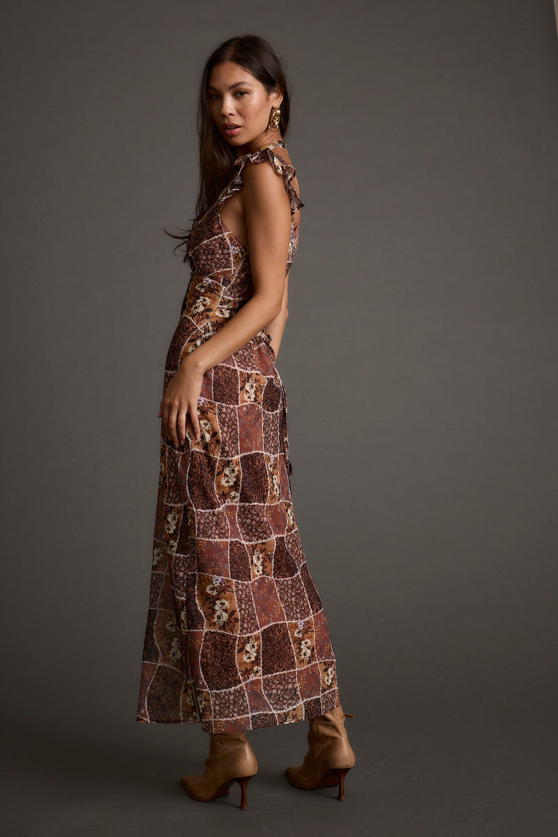 Full-length view of the midi dress showing the drape and movement.