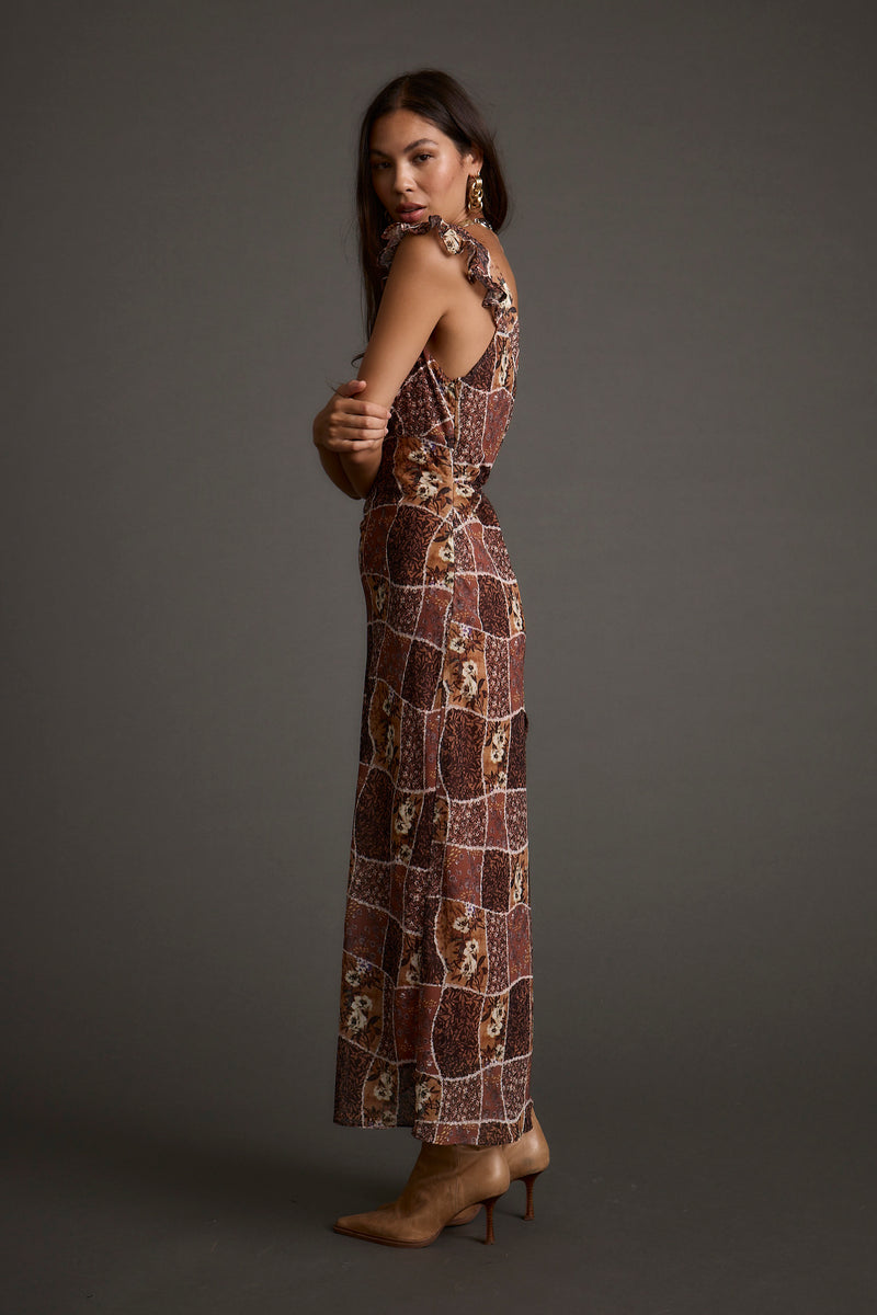 Lifestyle shot of the midi dress styled for day-to-night versatility.