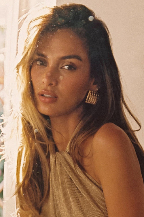 Gold earrings with refined detailing and an elegant finish.