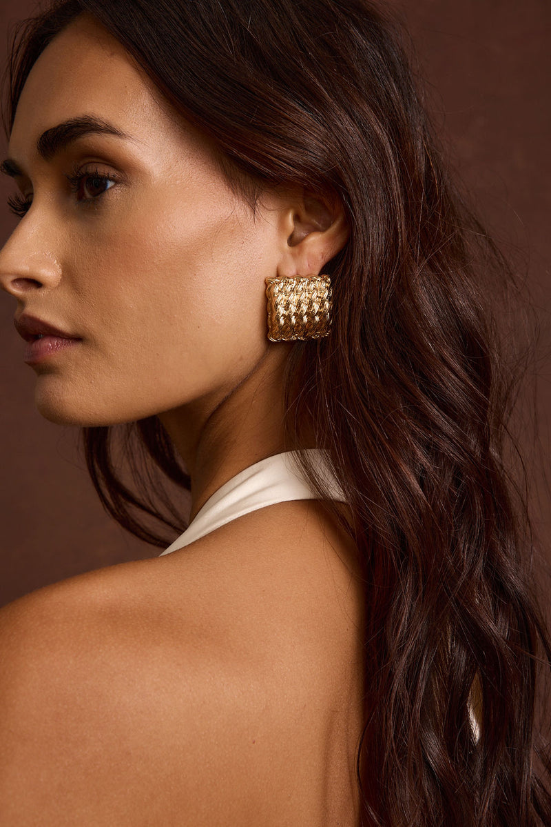 Detail shot of the Calaia Gold Earrings highlighting the design elements.