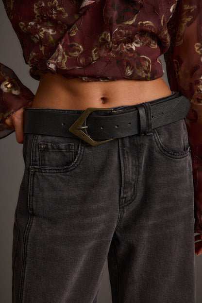Detail shot of the Calder Black Interchangeable Buckle Belt highlighting the design elements.