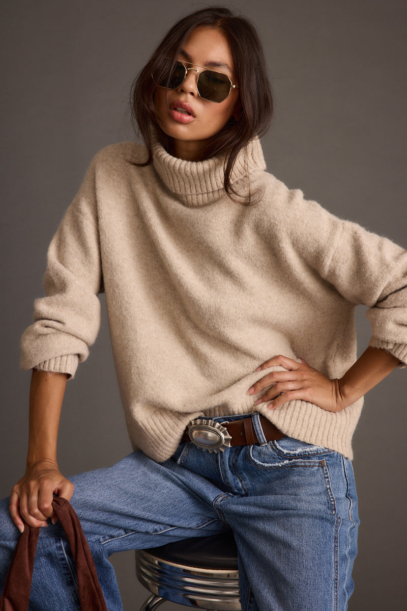 Back view of the sweater showing the silhouette and fit.