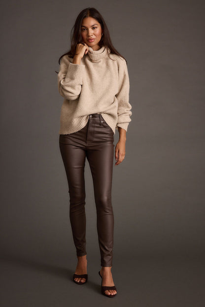 Lifestyle shot of the sweater styled for day-to-night versatility.