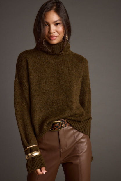 Full-length view of the sweater showing the drape and movement.