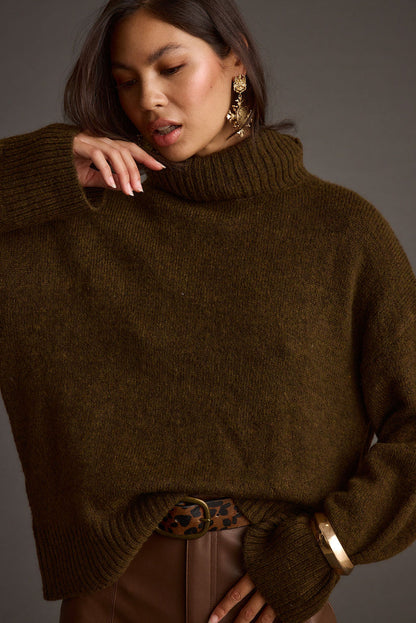 Detail shot of the Cedar Oversized Sweater Turtleneck highlighting the oversized elements.