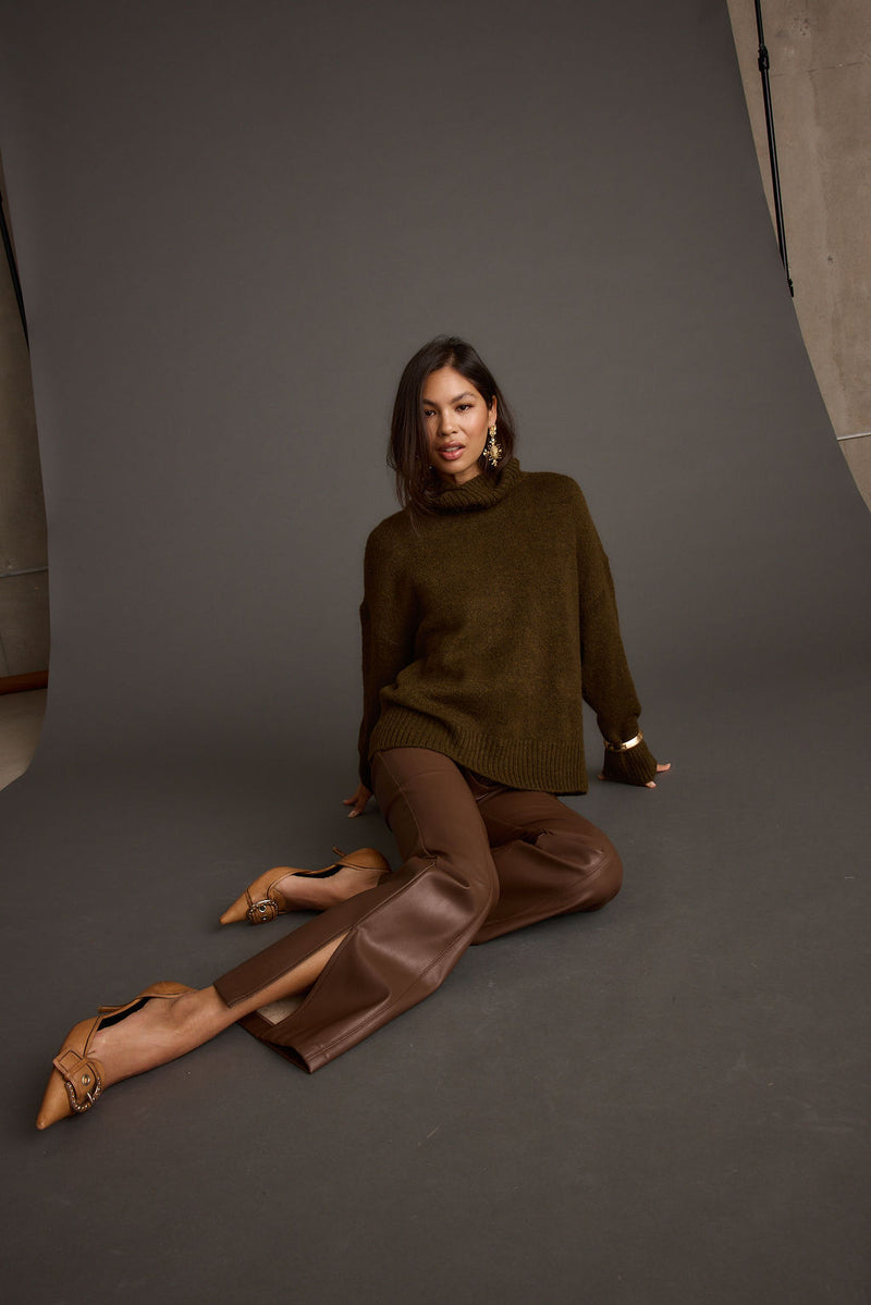 Lifestyle shot of the sweater styled for day-to-night versatility.
