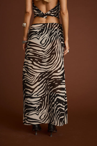 Celia Zebra Maxi Skirt paired with complementary accessories for a polished look.