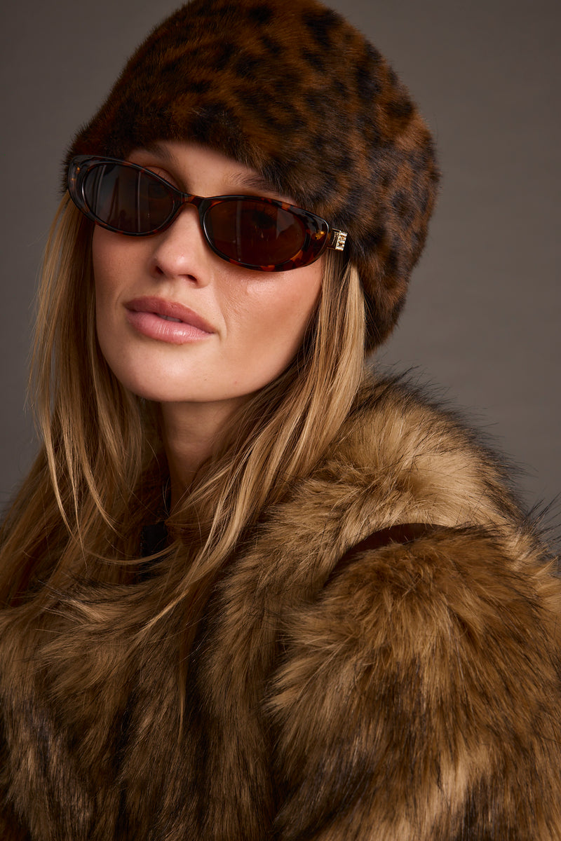 Alternate view of the leopard print hat showing the design and craftsmanship.