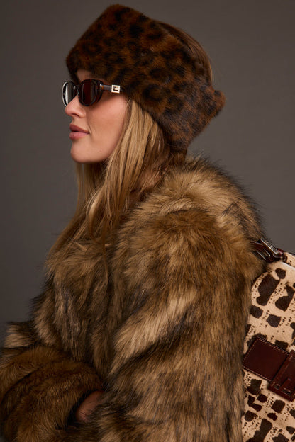 Close-up of the Chalet Leopard Faux Fur Headband showcasing the faux fur texture and craftsmanship.