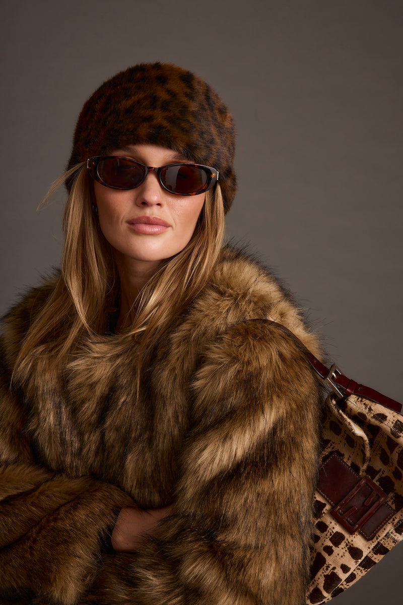 Chalet Leopard Faux Fur Headband styled in a complete look from an alternate angle.